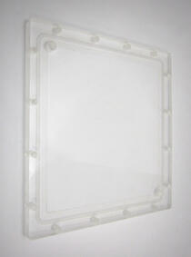 A square of machined acrylic